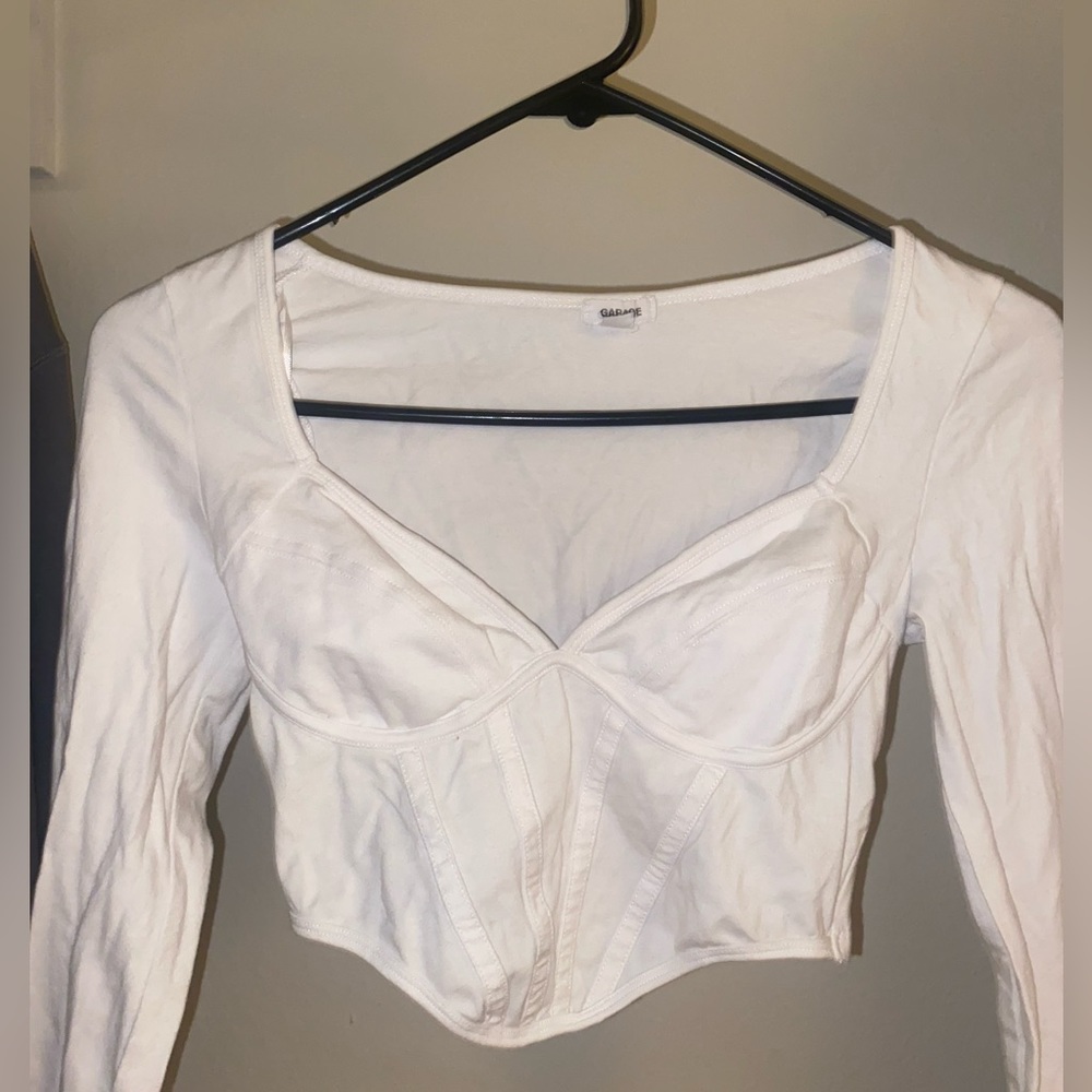 Size XS . White V neck long sleeve from Garage